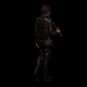 May include: A person in a black leather jacket and pants, holding a katana sword over their shoulder. The person is walking away from the camera against a black background. The sword has a gold-colored handle.
