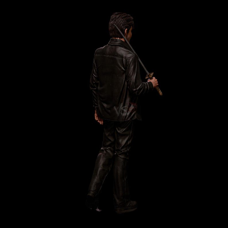 May include: A person in a black leather jacket and pants, holding a katana sword over their shoulder. The person is walking away from the camera against a black background. The sword has a gold-colored handle.