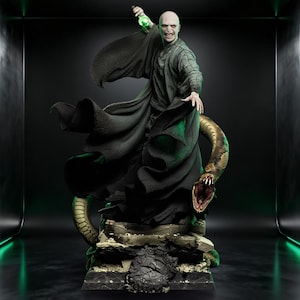 May include: A detailed statue of a bald figure in a dark robe, holding a glowing green object. A large snake coils around the base. The figure has a stern expression. The statue is on a stone base with intricate details. The overall theme is fantasy.