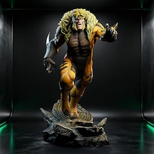 May include: A detailed statue of Sabretooth, a Marvel Comics character, in a dynamic pose. The figure is predominantly yellow and black, with a fierce expression and claws. It stands on a rocky base with a circular emblem.