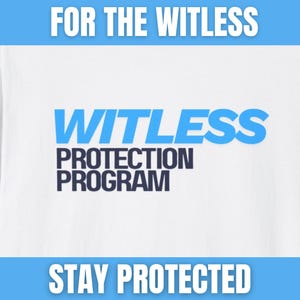 May include: White t-shirt with the text "FOR THE WITLESS" in white, "WITLESS" in blue, and "PROTECTION PROGRAM" in navy blue. The phrase "STAY PROTECTED" is at the bottom in white. A humorous graphic tee.