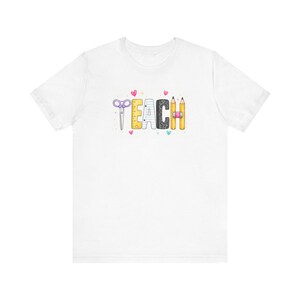 Teach graphic tee | Teacher shirt, school supplies design, pencil scissors letters