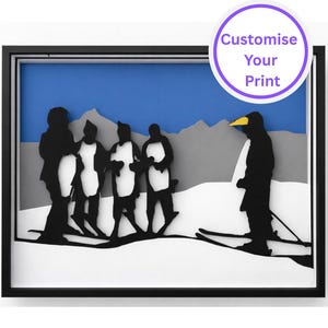 May include: A framed paper art piece depicting penguins in a snowy scene, with a black frame. The background features a blue sky and grey mountains. One penguin is skiing. The text "Customise Your Print" is in a purple circle in the top right corner.