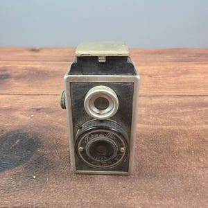 Falcon Flex Box-kamera 50 mm Graf-objektiv svart i bra vintage-stil i art déco-täckljus