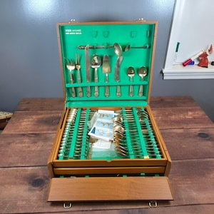 May include: A rustic wooden sign with the text "Welcome to our home" in white lettering. The sign features a distressed finish and a simple, inviting design, perfect for entryway decor.