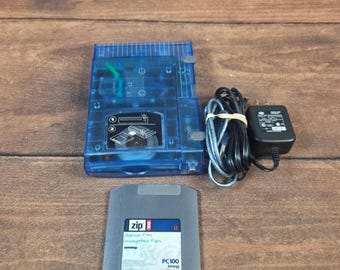 Unidad externa USB Iomega Zip 100 azul, excelente estado, translúcida, paquete atómico.