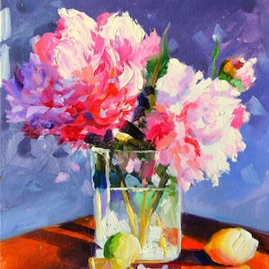 May include: Oil painting of pink and white peonies in a clear glass vase. A lemon and lime sit on a reflective, reddish-brown surface. The background is a deep blue.