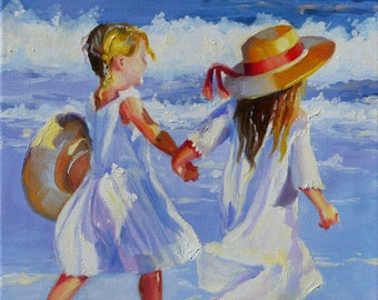 May include: Two girls in white dresses walk on a beach with blue water and white clouds in the background. One girl wears a yellow and red sun hat. The girls are reflected in the water.
