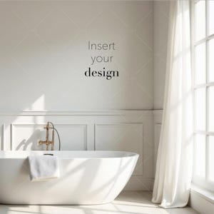 May include: A bright, minimalist bathroom scene featuring a white, oval-shaped bathtub with a gold faucet. A white towel hangs on the tub's edge. The text "Insert your design" is on the wall. A sheer white curtain hangs near a window.