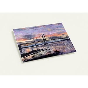 May include: A colorful painting of a suspension bridge over water at sunset. The sky is a mix of purple, orange, and yellow hues, reflecting in the water below. The bridge's silhouette is dark against the vibrant sky.