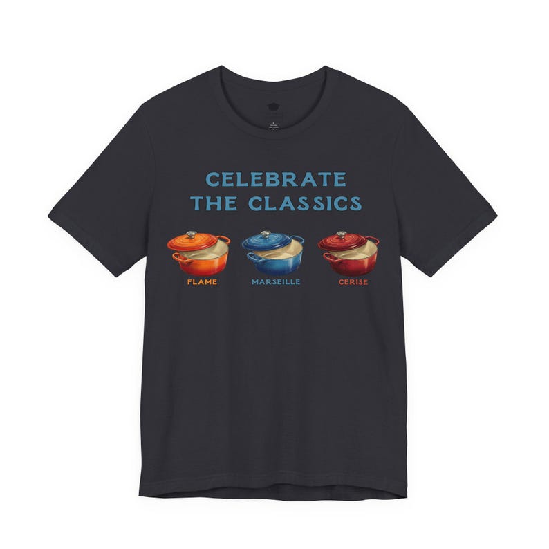 Black crew-neck t-shirt reads, "CELEBRATE THE CLASSICS" with three dutch ovens, in colors Flame, Marseille, and Cerise.