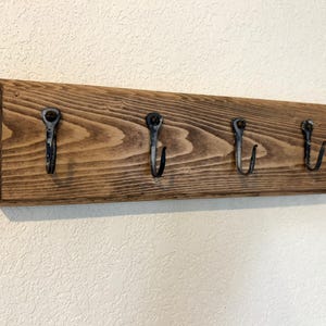 Hand Forged Hooks on Wooden Boards
