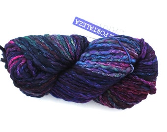 Malabrigo Caracol in color Fortaleza, #722, Super Bulky thick and thin superwash merino knitting yarn in blues, rose