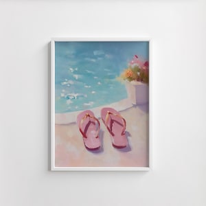 May include: A framed painting depicts a sunny scene with pink flip-flops with gold straps resting near a pool. The water is a bright blue with shimmering highlights. A white flower pot with colorful flowers sits nearby.