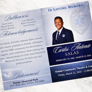 以下が含まれることがあります： カルロス・アントニオ・サラスの肖像画が描かれた追悼カード。追悼式典の詳細と生年月日と死亡日が含まれています。カードは青と白の配色で、EMSのロゴが含まれています。