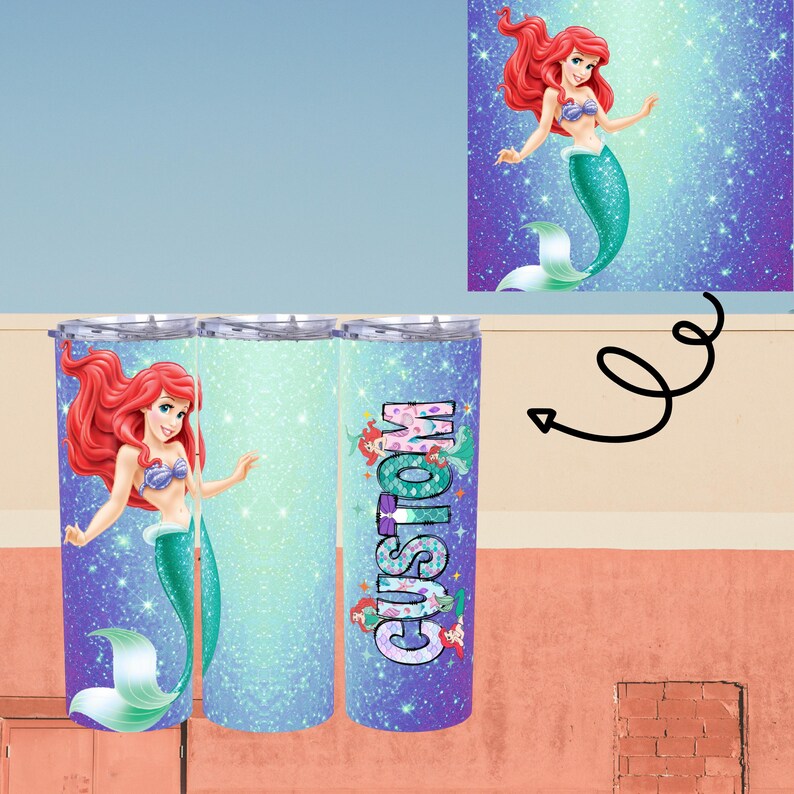 May include: A set of three stainless steel tumblers with a mermaid theme. Each tumbler features a mermaid illustration with red hair and a teal tail. The word "CUSTOM" is printed on one tumbler. The background has a glittery effect.