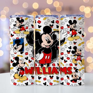 May include: A white cylindrical tumbler featuring a repeating pattern of Mickey Mouse in various poses, red shorts, and yellow shoes. The design includes scattered Mickey head silhouettes and the name WILLIAMS printed in bold red letters.