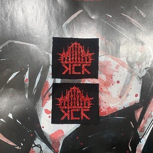May include: Two black patches with a red glitter design. The design features a stylized crown above the word "SICK" in a bold font. The patches are likely for clothing or accessories.