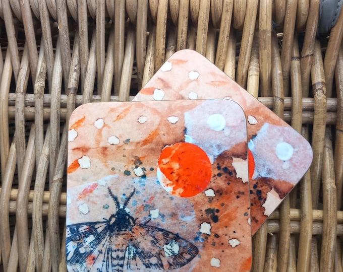 Coasters with moth and orange moon
