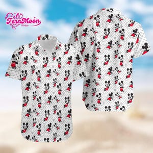 May include: White button-up short-sleeve shirt featuring a repeating pattern of Mickey Mouse in red, black, and white. The shirt has a classic collar and is set against a blurred beach background. The Fern Moon Design logo is visible in the upper left corner.