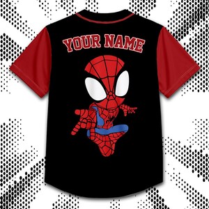 A black and red t-shirt with a Spiderman graphic and the text "YOUR NAME" printed on the back.