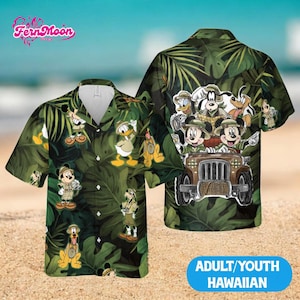 May include: Green Hawaiian shirt featuring Disney characters in safari outfits, including Mickey Mouse, Donald Duck, and Goofy, set against a backdrop of lush green foliage. The shirt has a button-down front and short sleeves. The text "ADULT/YOUTH HAWAIIAN" is visible.
