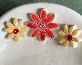 Red and yellow daisies with lovely crystals on white oval dish. Use to hold rings, kitchen sponge, keys and more. Handmade pottery.