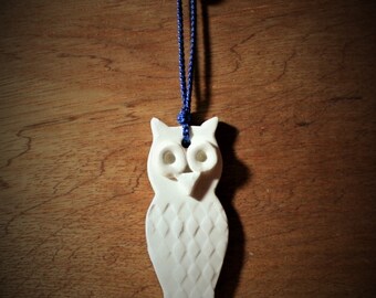 White Owl ornament with blue ribbon. White ornament will really show up on tree, present or wreath