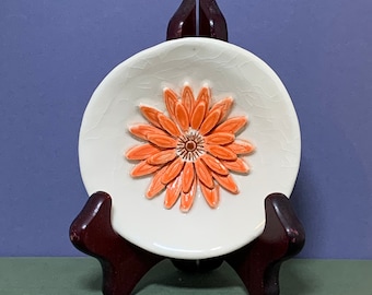 Gerber Daisy Dish (Orange). Porcelain design preserves this lovely flower in a wedding favor, bridesmaid gift, or quinceanera color scheme.