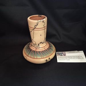 May include: A set of three ceramic mugs with a speckled, matte finish. The mugs are in shades of cream, light gray, and dark gray. Each mug has a simple, minimalist design, perfect for coffee or tea.