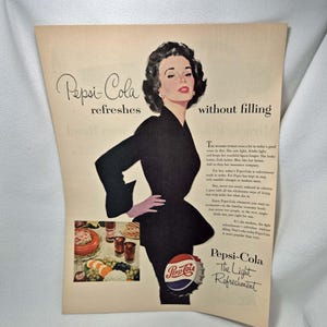 May include: Vintage Pepsi-Cola advertisement featuring a woman in a black dress. The ad includes the Pepsi-Cola logo and the text "Pepsi-Cola refreshes without filling". A colorful illustration of food and drinks is also present.