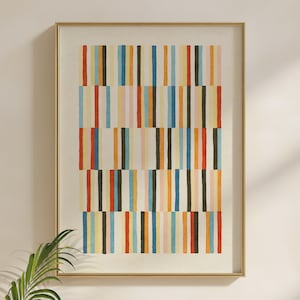 May include: A framed wall art print featuring a repeating pattern of vertical stripes in various colors including red, blue, yellow, orange, black, and light pink. The stripes are arranged in horizontal blocks, creating a grid-like composition.