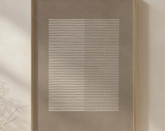 May include: Framed abstract art print featuring a rectangular design of horizontal white lines on a taupe background. The artwork is encased in a gold-colored frame, adding a touch of elegance to the minimalist composition.