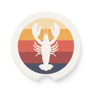 May include: White car coaster featuring a lobster silhouette against a retro sunset design. The background has horizontal stripes in shades of orange, red, and navy blue. The coaster has a small notch for easy removal.