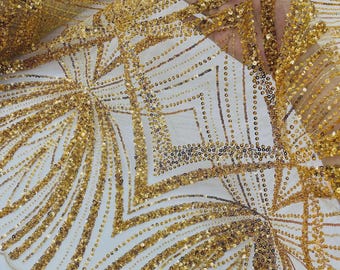 May include: A sheer fabric featuring an intricate geometric pattern embroidered with metallic gold thread and densely applied gold sequins. The design consists of repeating diamond shapes and radiating fan-like lines, creating a textured surface.