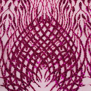 May include: Close-up of a magenta fabric with intricate beaded and sequined patterns. The design features a lattice-like structure at the bottom, with vertical and curved lines extending upwards. The fabric has a sheer, light pink backing.