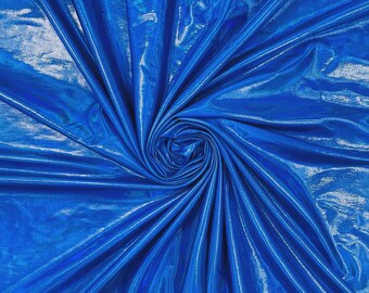 May include: A vibrant royal blue fabric with a high-gloss, metallic finish. The material is gathered into a central spiral, creating deep, radiating folds and highlights that emphasize the reflective, smooth texture of the synthetic textile surface.