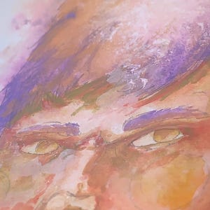 May include: Watercolor painting of a person's face, featuring warm tones of orange, peach, and brown. The eyes are a light yellow, and the eyebrows are a deep purple. The artwork has a soft, blended style.