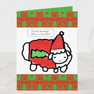 May include: A Christmas card featuring a sheep wearing a Santa hat and a red coat with a green Christmas tree design. The card has a red and green Christmas tree pattern border and the text "Baaah humbug! Fleece Navidad!"