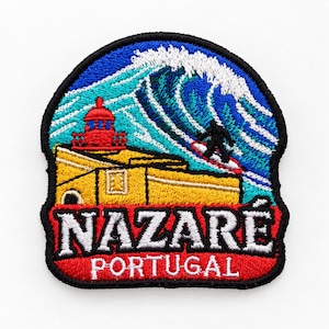 May include: An embroidered patch featuring a yellow lighthouse and a large blue ocean wave with a surfer. The text NAZARÉ is in white on a red background, with the word PORTUGAL in white below. The patch has a black border and rounded top.
