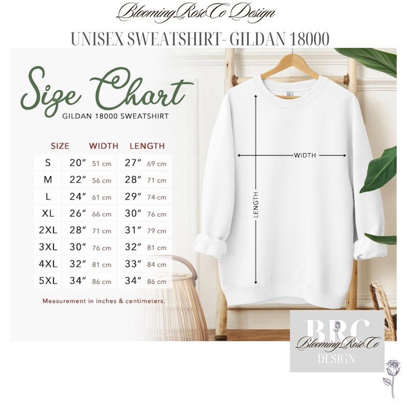 May include: A white Gildan 18000 unisex sweatshirt displayed on a hanger, with a size chart showing measurements in inches and centimeters. The chart lists sizes S to 5XL, with width ranging from 20" to 34" and length from 27" to 34".