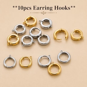May include: A collection of 10 pieces of earring hooks in gold and silver tones. These circular jewellery findings feature a hinged mechanism and a small loop for attachment, presented as a set of 10pcs Earring Hooks for jewellery making projects.