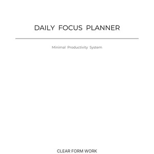 May include: A white planner cover with the text "DAILY FOCUS PLANNER" in a sans-serif font. Below the title is a horizontal line, followed by "Minimal Productivity System". The bottom of the cover reads "CLEAR FORM WORK".
