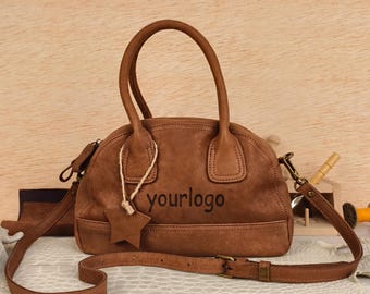 Bolso bandolera vintage hecho a mano de auténtica piel de vaca con logotipo grabado a láser.