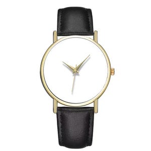 May include: A minimalist wristwatch with a gold-tone case and hands, a white dial, and a black leather band. The watch has a simple, elegant design, suitable for everyday wear. The watch band is approximately 0.75 inches wide.