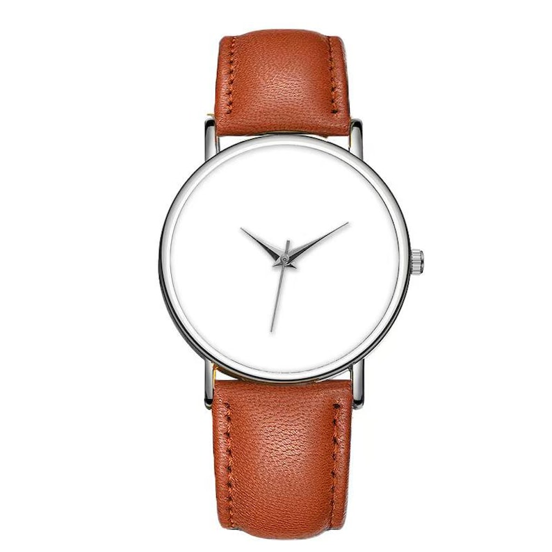 May include: A minimalist wristwatch with a white face and silver hands. The watch has a brown leather band and a silver case. The watch is a classic design, suitable for everyday wear.