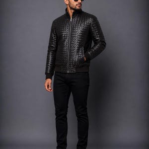 Black leather bomber coat with detailed woven texture and classic fit