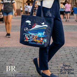 May include: A navy blue tote bag featuring a graphic of a cruise ship, white clouds, and various cartoon characters. The text "Disney Cruise 2026" is printed in blue and red. The bag has two shoulder straps and a large main compartment for storage.