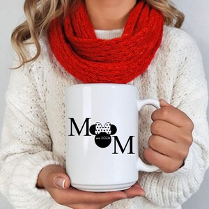 May include: A set of three ceramic mugs with a speckled, matte finish. The mugs are in shades of cream, light gray, and dark gray. Each mug has a simple, minimalist design, perfect for coffee or tea.