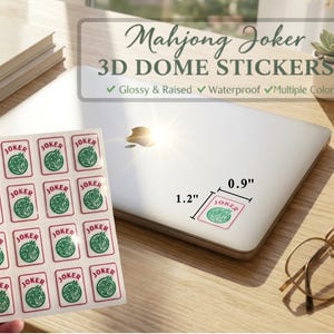 May include: A sheet of glossy, raised, waterproof 3D dome stickers with a Mahjong Joker design. Each sticker is 1.2 inches by 0.9 inches and features a red border, the word "JOKER", and a green graphic. The stickers are on a white background.